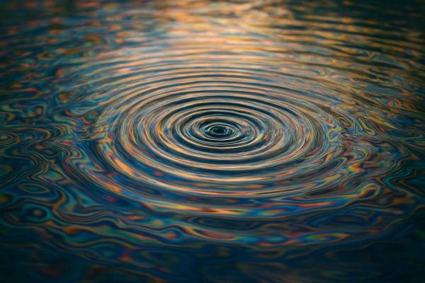fascinating auditory stimuli, captivated, blending, photorealistic, illustrated through patterns on the water surface, highly detailed, ripple effects, long exposure, multicolored, gentle lighting, shot with a 50mm lens.